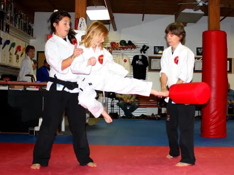 a group of people in karate uniforms