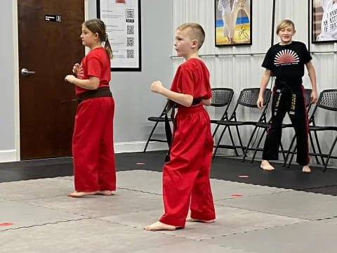 a group of people in red uniforms