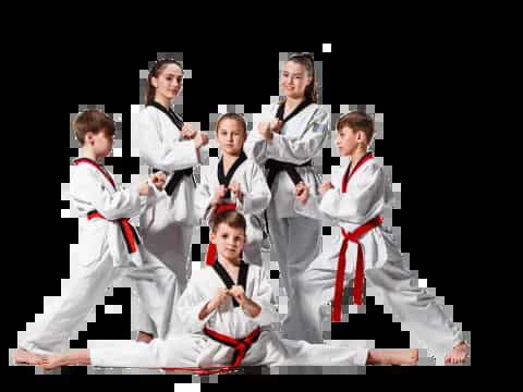 a group of men in white karate uniforms