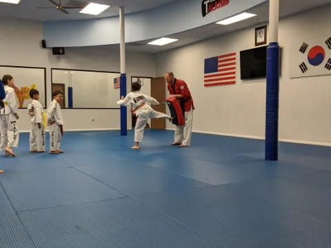 a group of people in a karate class