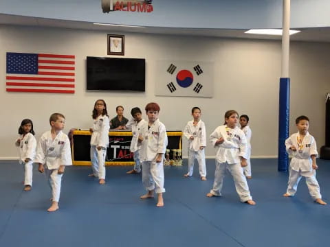 a group of people in karate uniforms