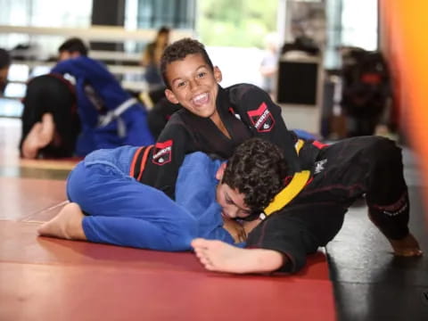 a couple of boys lying on the floor