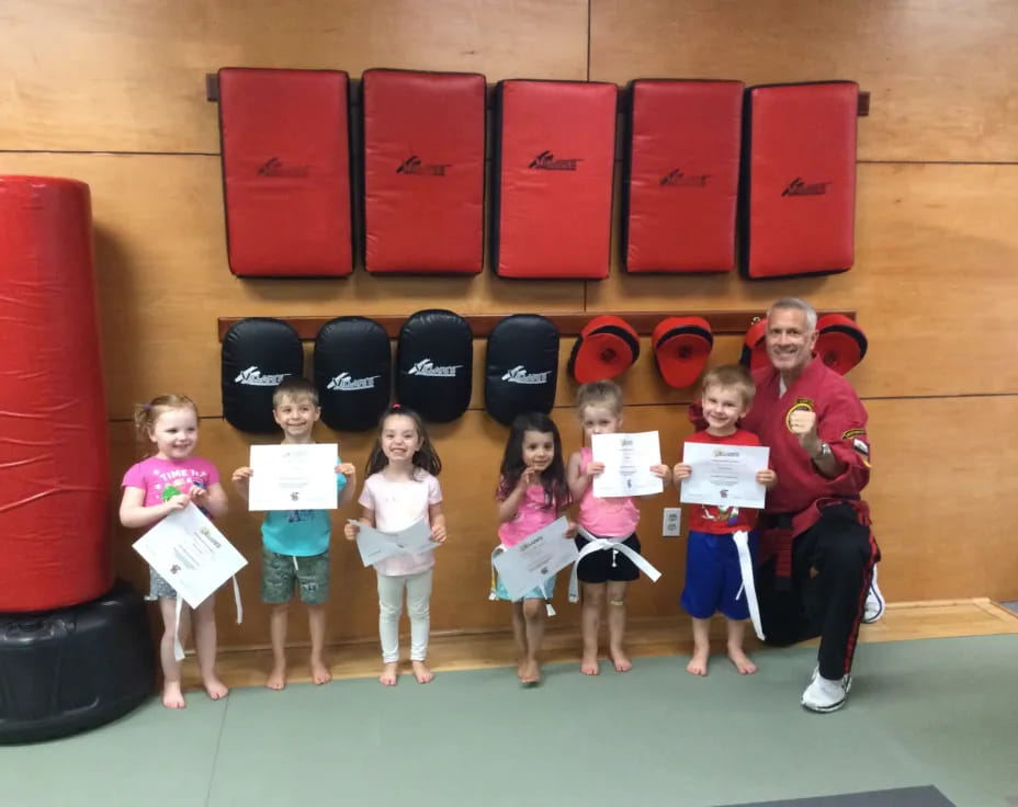 a group of children holding up signs