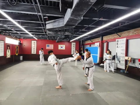 a group of people in karate uniforms