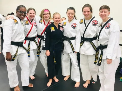 a group of people in karate uniforms