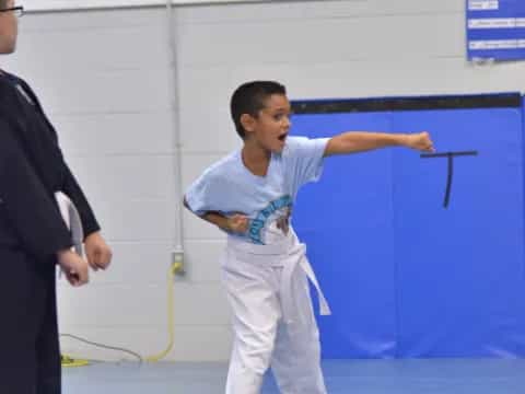 a boy in a karate uniform