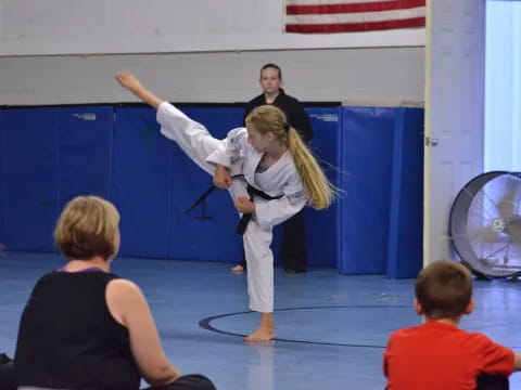 a girl doing a karate move