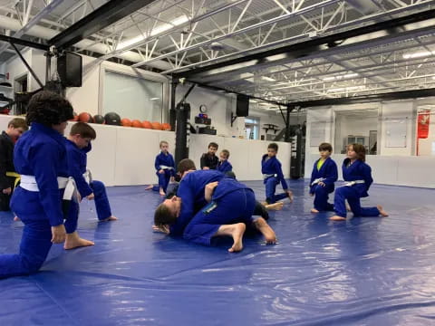 a group of people in blue karate uniforms