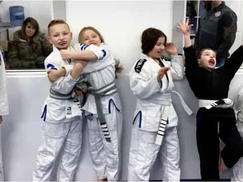 a group of people in karate uniforms