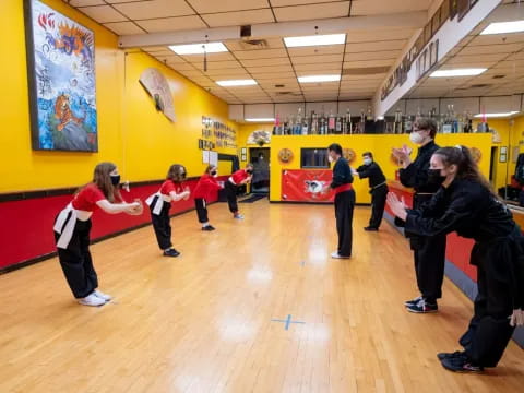 a group of people exercising in a gym