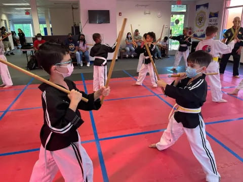 a group of kids practicing karate