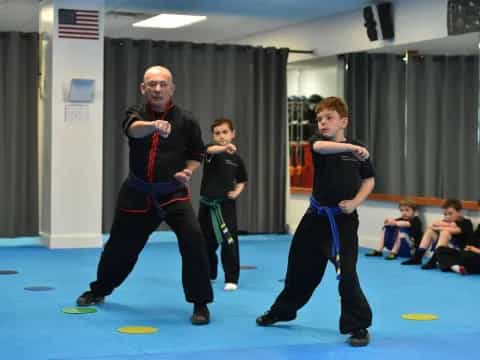 a person and a boy in a karate uniform