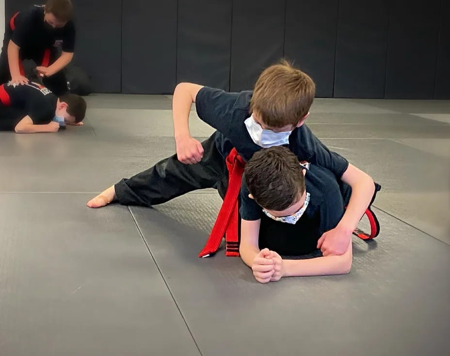 a group of people kneeling on the floor