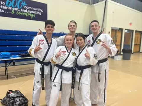 a group of people in karate uniforms