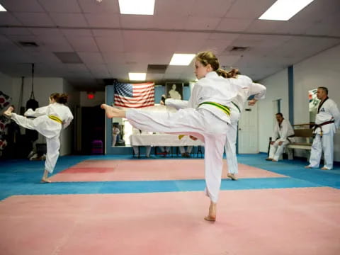 a group of people in karate uniforms