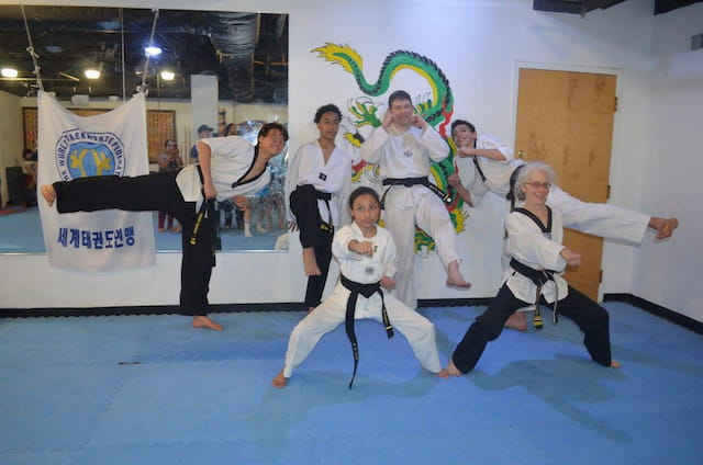 a group of people in karate uniforms