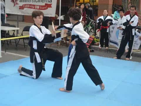 two boys in karate uniforms