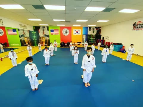 a group of children in karate uniforms