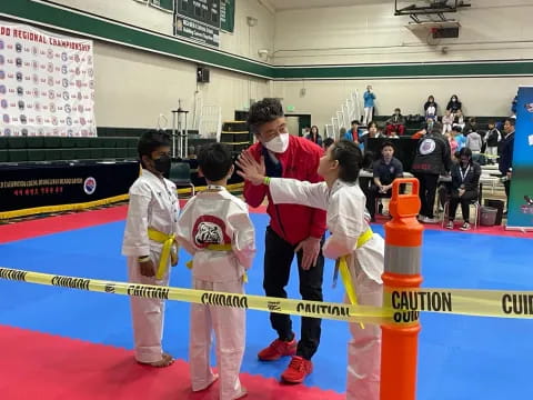 a group of people in karate uniforms