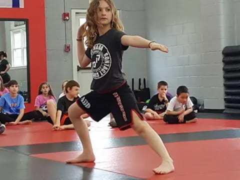 a girl dancing on a mat