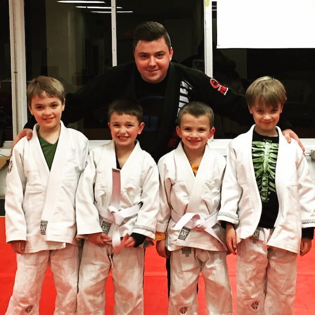 a group of boys in karate uniforms