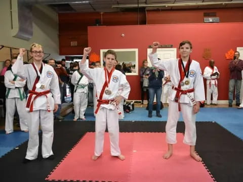 a group of people in karate uniforms