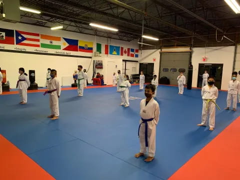 a group of people in karate uniforms