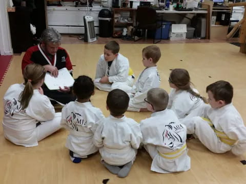 a group of children sitting on the floor