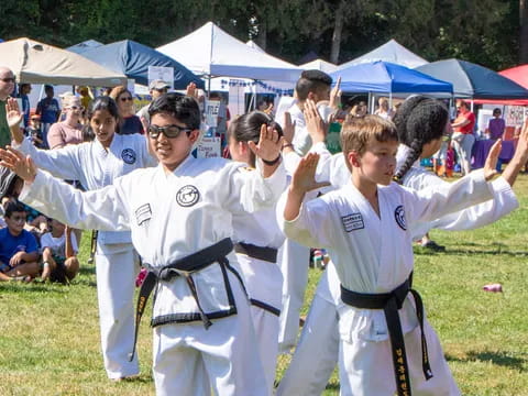 a group of people in karate uniforms