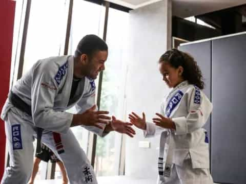 a man and a woman in white uniforms shaking hands