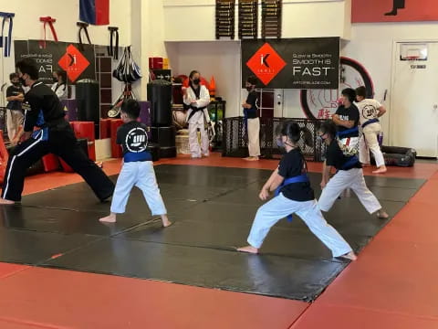 a group of people in a karate class