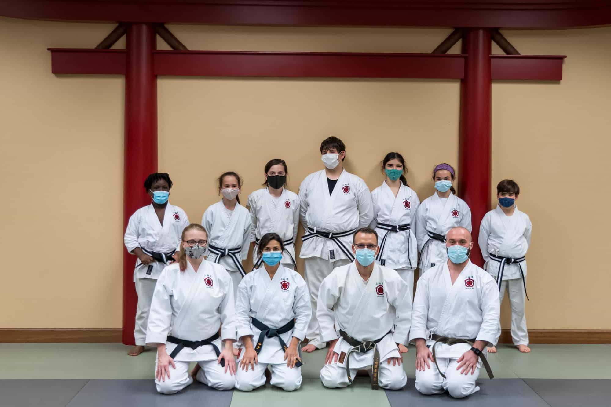 a group of people wearing white uniforms