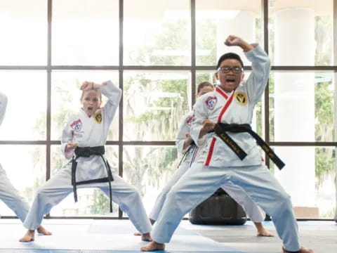 a group of people in karate uniforms