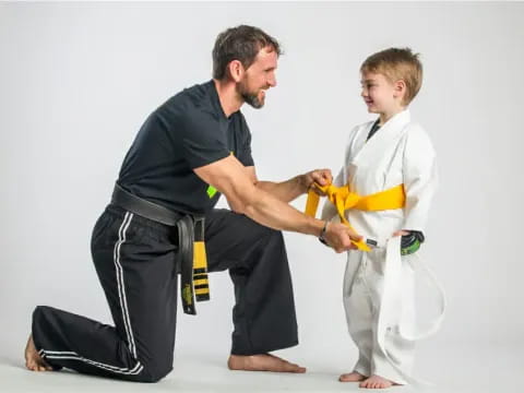 a man and a woman in karate uniforms