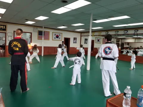 a group of people in karate uniforms