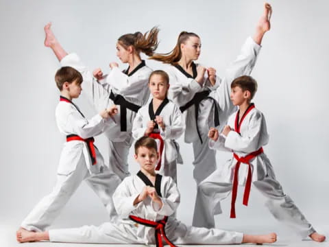 a group of people in karate uniforms