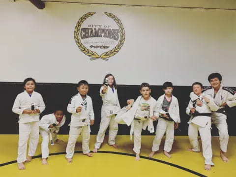 a group of people in karate uniforms