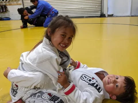 a person and a boy lying on the floor