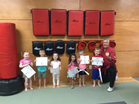 a group of children holding up signs