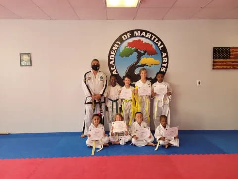 a group of people in karate uniforms