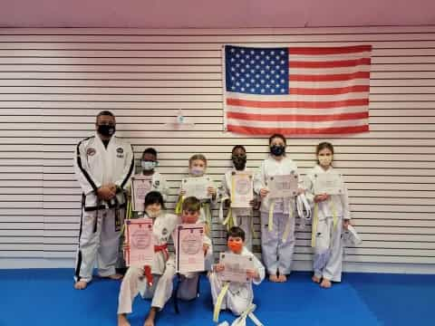 a group of people in karate uniforms