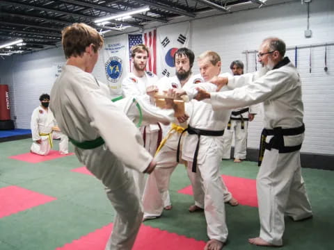 a group of men in karate uniforms