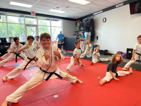 a group of people in karate uniforms