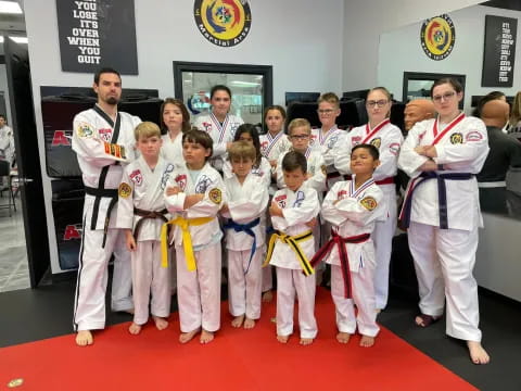 a group of people in karate uniforms