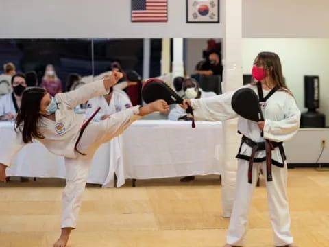 a group of people in karate uniforms