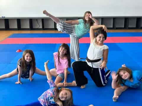 a group of girls on a mat