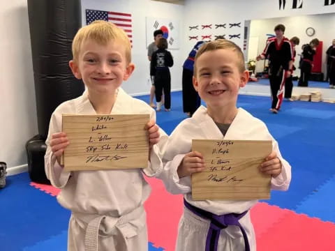 two boys wearing karate uniforms