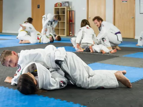 a group of people in karate uniforms