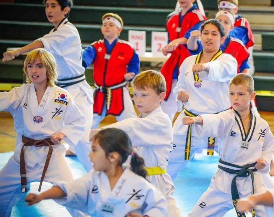 a group of people in karate uniforms