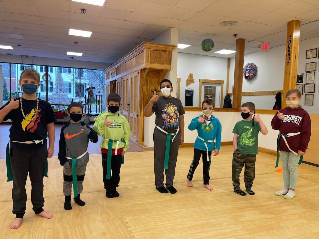a group of kids wearing masks